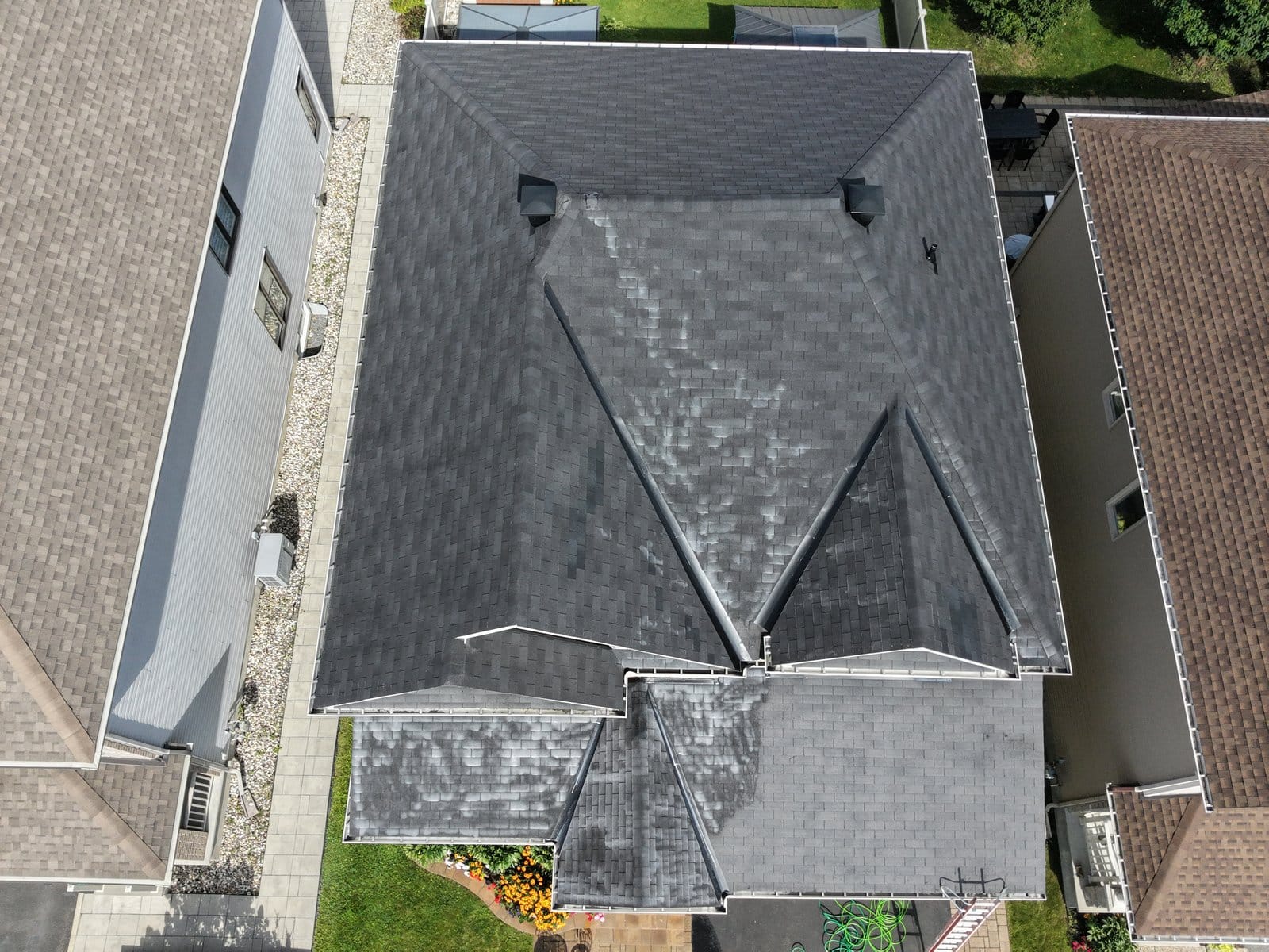 Aerial overhead view of a residential roof after rejuvenation.
